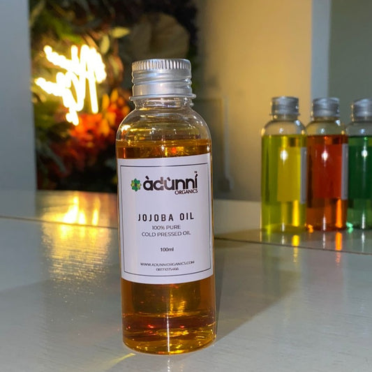 Bottle of Adunni Organics Cold Pressed Pure Jojoba Oil